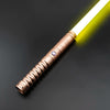 A close-up of an RGB heavy dueling lightsaber with a metallic hilt and glowing blade against a dark background.