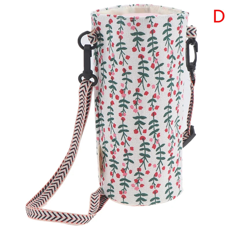 A portable canvas water bottle crossbody bag with a white and green floral pattern.