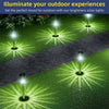 Ten bright solar garden path lights illuminating a green lawn and paved walkway at night