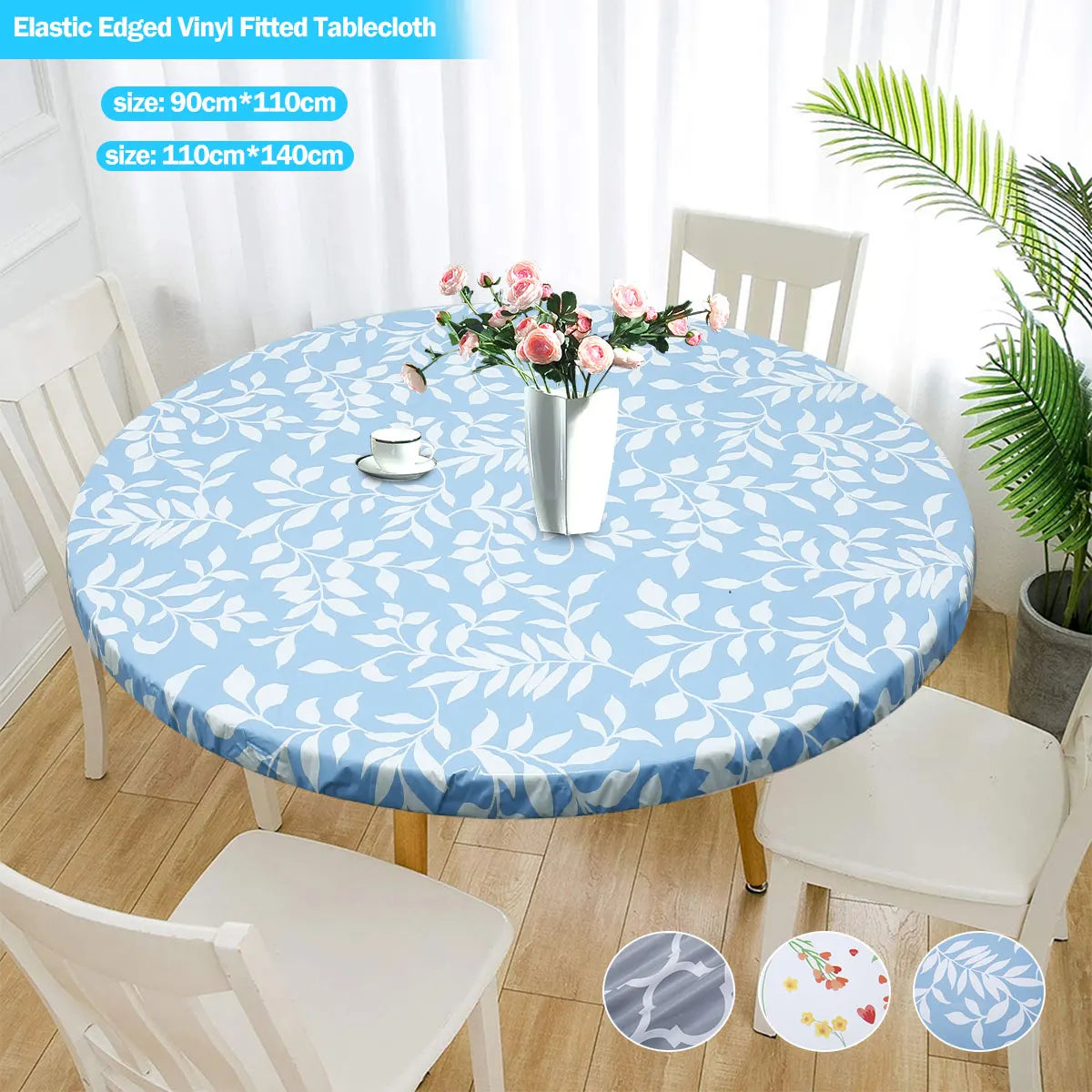 Light blue floral patterned elastic-edged vinyl tablecloth set with a white table and chairs