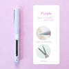 A purple paper carving knife and scissors set displayed on a white card against a pink background.