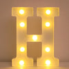 A glowing letter H made of LED lights used as a night light or party decor.