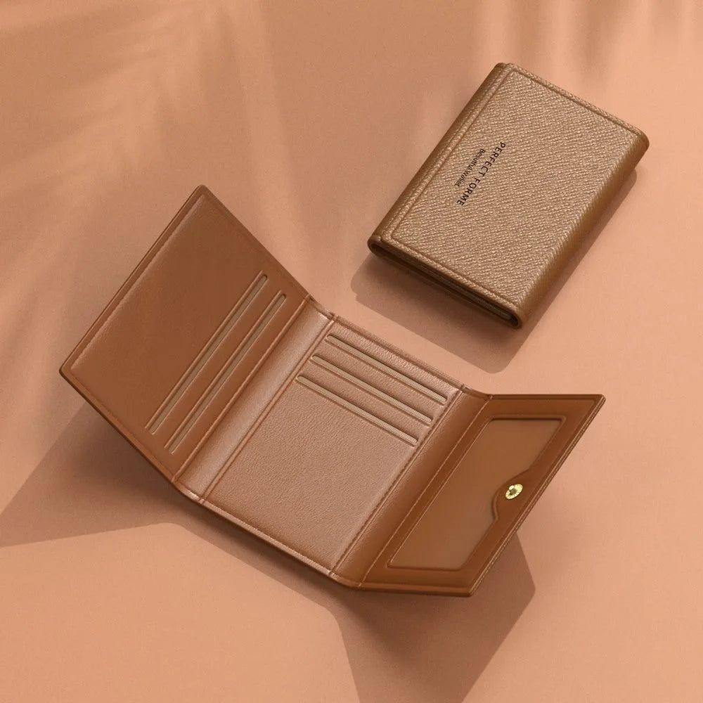 A brown leather card holder wallet is shown open and a folded version is displayed on a beige background.