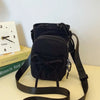 A black bow-decorated casual crossbody bag with an adjustable strap is shown against a light background.