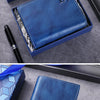 A dark blue genuine leather men's bifold wallet with RFID protection is shown in an open box and being held by a hand.