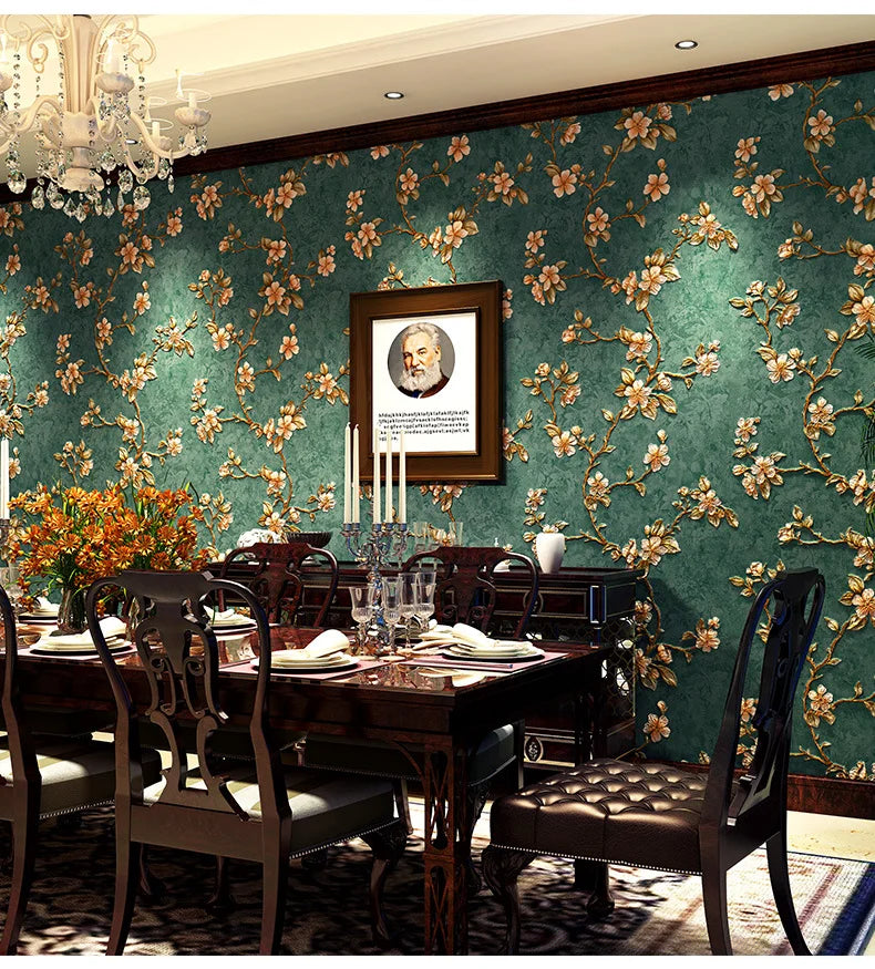 A richly decorated dining room featuring dark wood furniture and a teal floral wallpaper backdrop.
