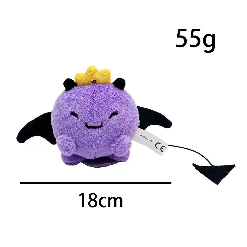 A purple plush doll with yellow tufts on its head, shown against a white background.