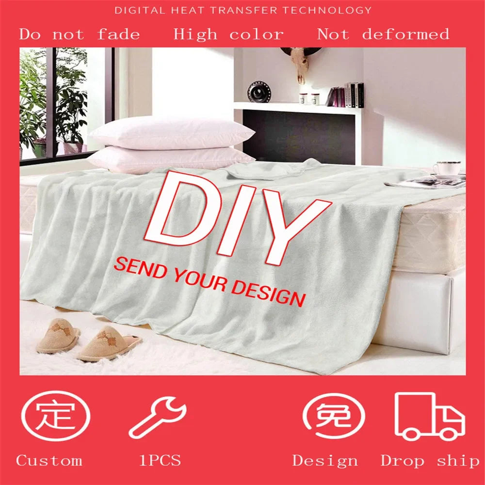 A gray flannel throw blanket with a vintage skull print is displayed on a bed.