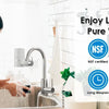 A mother and child are using a faucet mount water filter in a kitchen sink.