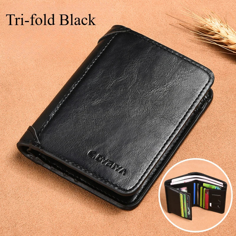 A black tri-fold leather card holder wallet shown on a brown surface.