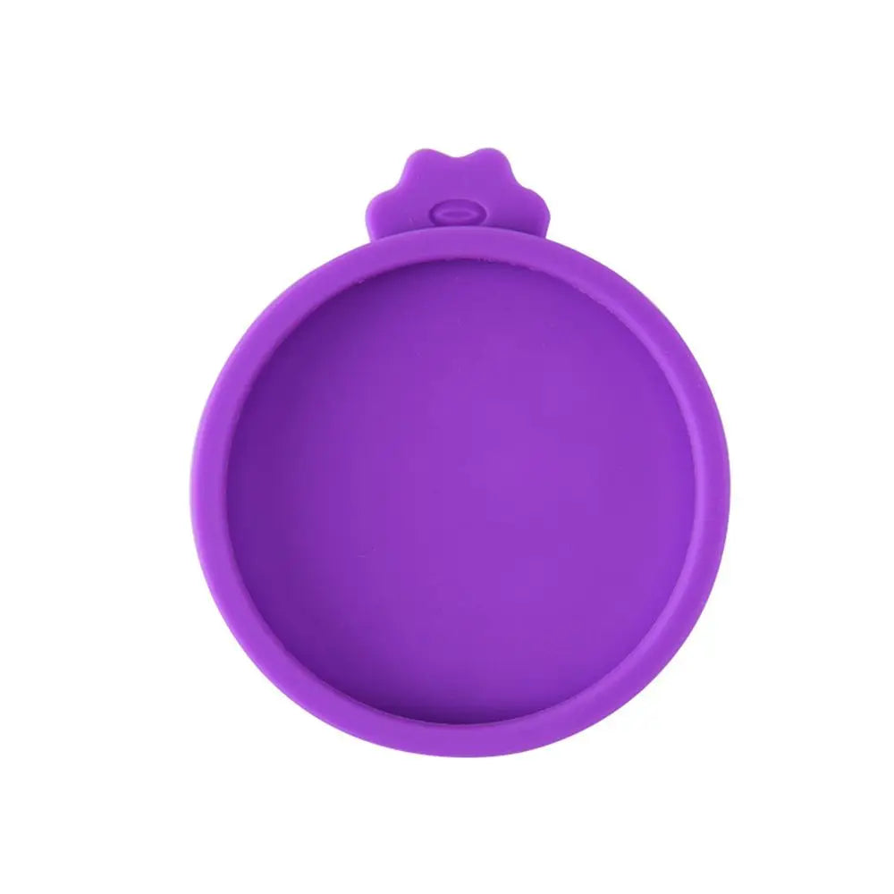 A purple reusable silicone food storage lid with a rounded shape.