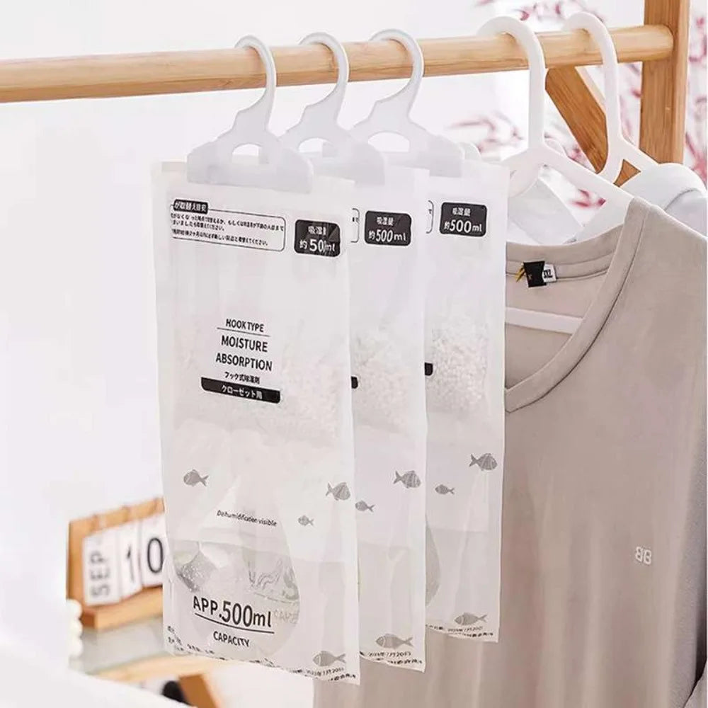 White hanging bags of moisture absorber for wardrobe and closet
