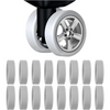 A set of four silicone suitcase wheel protectors designed to cover and protect caster wheels.