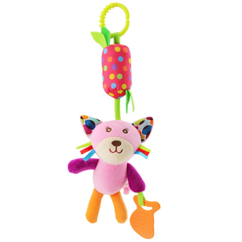 A soft plush baby rattle toy shaped like a pink cartoon animal with a hanging bell.