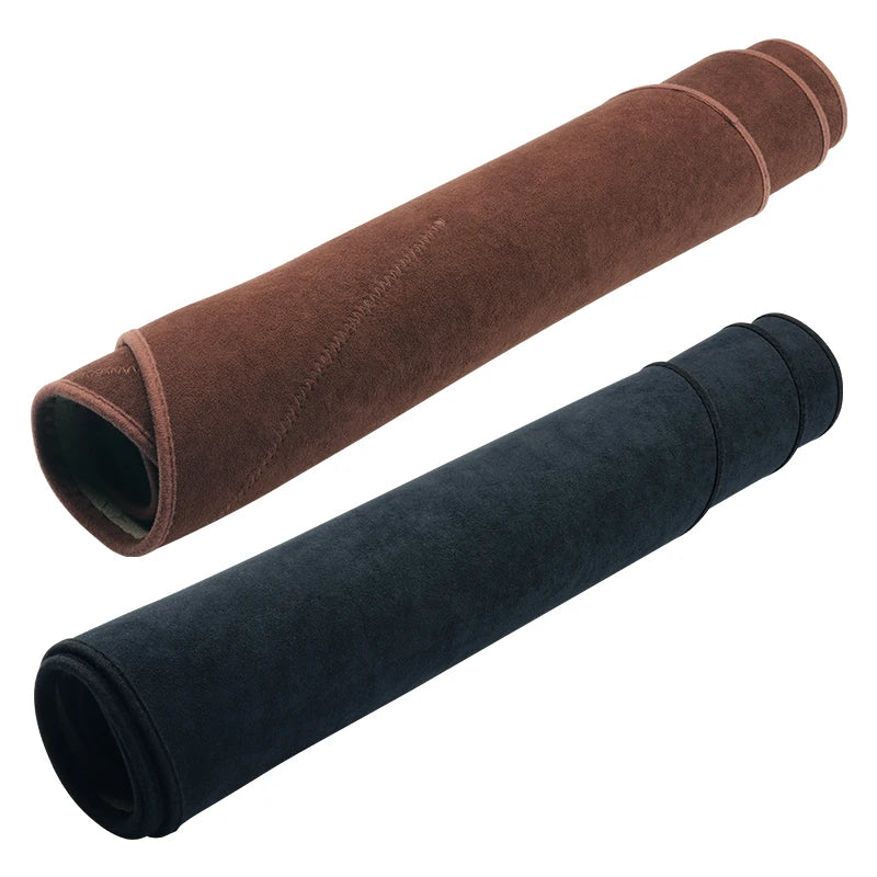 Two rolls of custom fit dashboard sun shields, one brown and one black.
