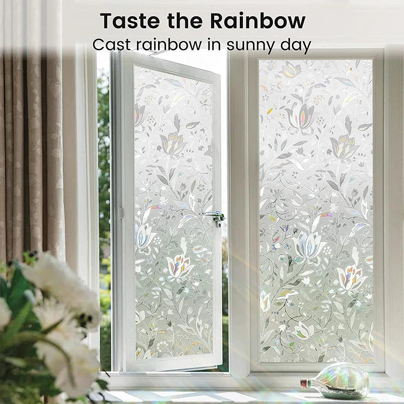 Decorative window film casting a rainbow effect on a sunny day through a glass door.
