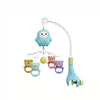 A musical baby crib mobile featuring an owl, a yellow ball, and a pink bear, designed for soothing sounds.