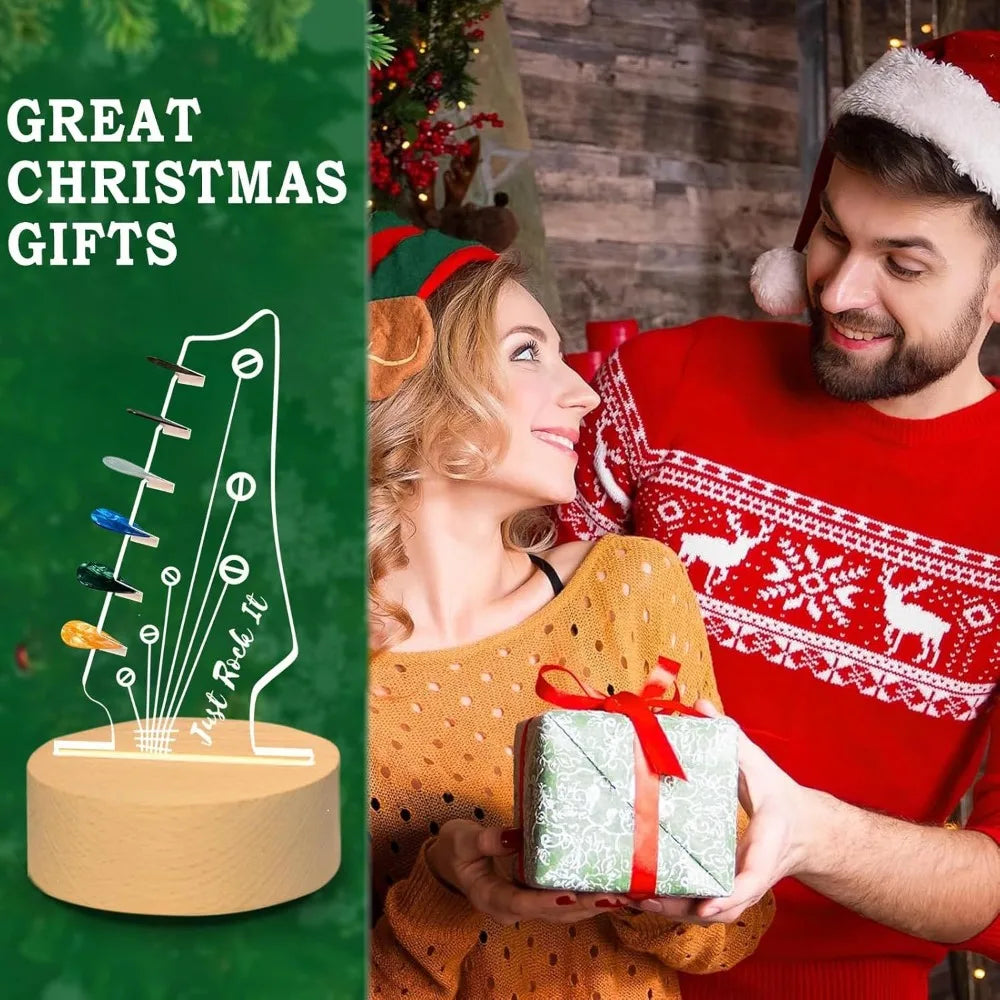 A woman smiles while holding an illuminated acrylic guitar pick holder with a wooden base in a festive Christmas setting.