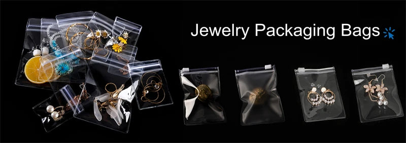 A collection of jewelry packaging bags, including clear resealable pouches holding various gold and silver accessories.