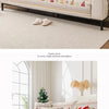 A beige chenille sofa cover featuring a festive Christmas tree pattern with red and green accents.