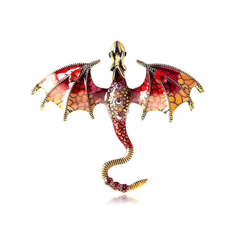An enamel dragon brooch featuring iridescent scales and rhinestone accents, displayed against a white background.