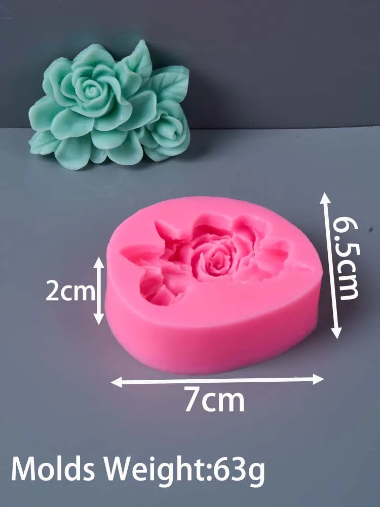 A pink silicone mold shaped like a rose flower, next to a green fabric flower.