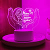 A glowing heart-shaped LED night light featuring a silhouette of a mother and text that reads I love you with all my heart.