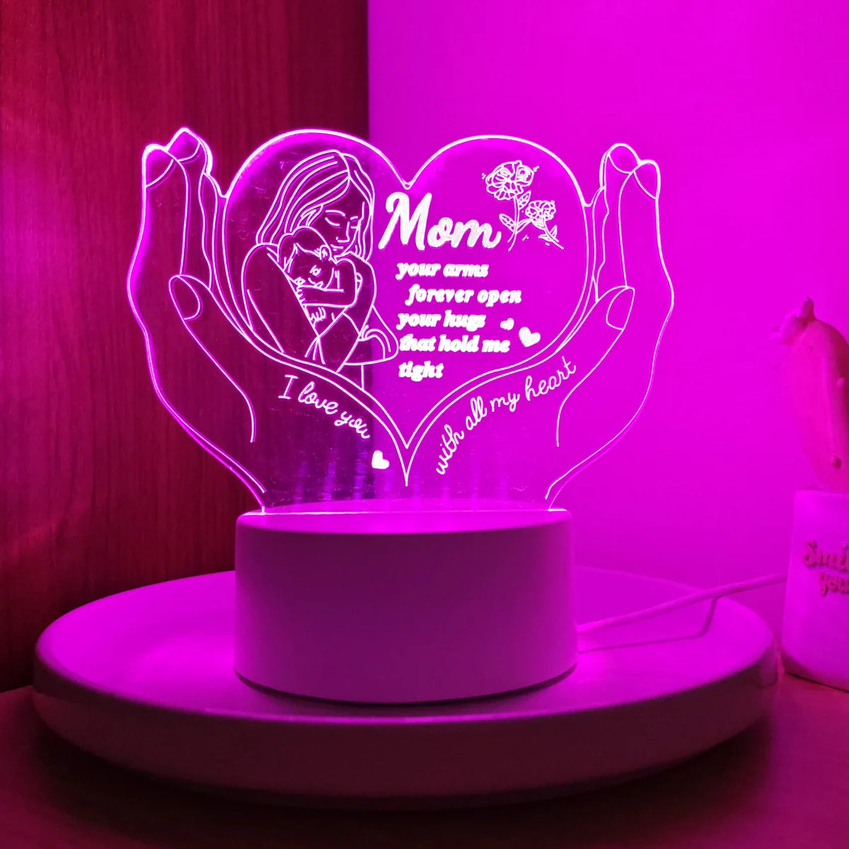 A glowing heart-shaped LED night light featuring a silhouette of a mother and text that reads I love you with all my heart.
