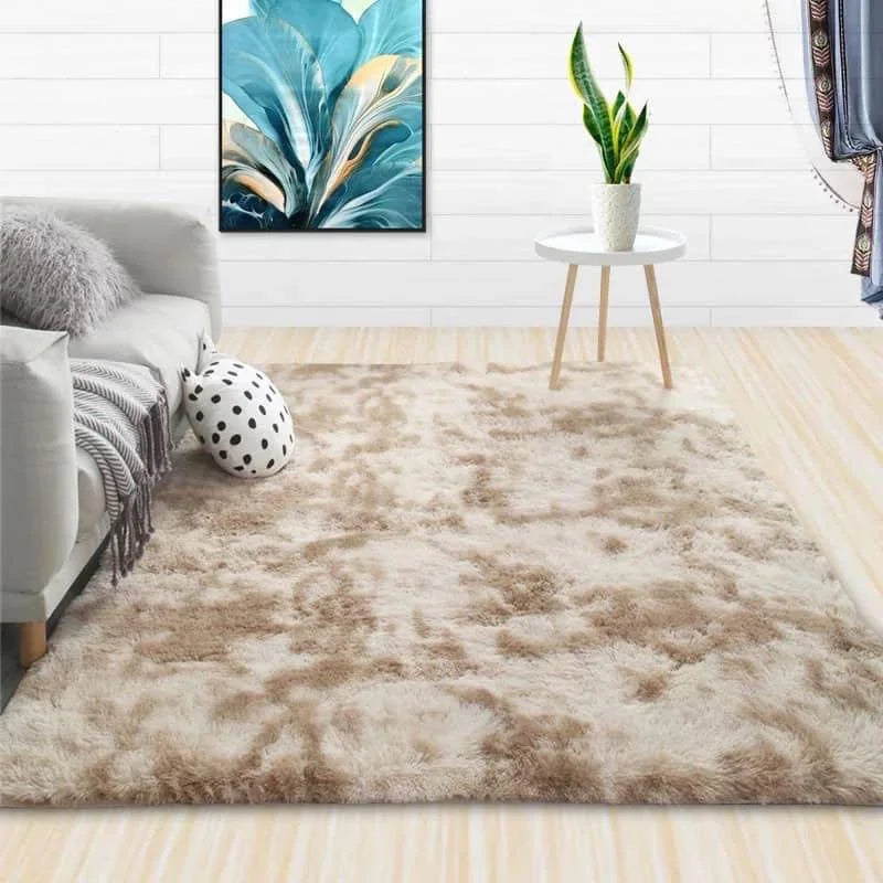 A fluffy beige luxury velvet carpet placed in a modern living room with white walls and decor.