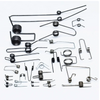 A collection of black metal double torsion springs for DIY projects and repairs