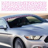 A silver car is shown with a leopard print sunshade decal strip applied to the windshield.