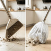 A close-up view of a disposable electrostatic broom cover being used to clean a wooden floor.