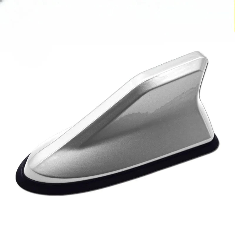 Silver aerodynamic shark fin car antenna with signal amplifier