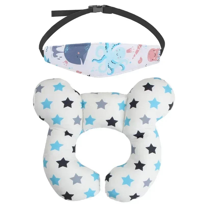 A white and blue patterned baby head and neck support pillow with a black safety strap.