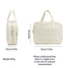 A cream-colored portable hanging toiletry bag with a quilted design shown next to its dimensions.