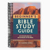 A spiral-bound guide titled Beginner's Bible Study Guide with a sunset landscape background.