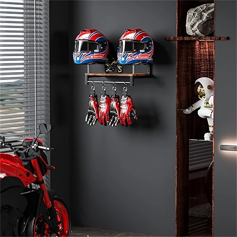 A display featuring red and blue motorcycle helmets and leather gloves mounted on a dark wooden wall shelf.