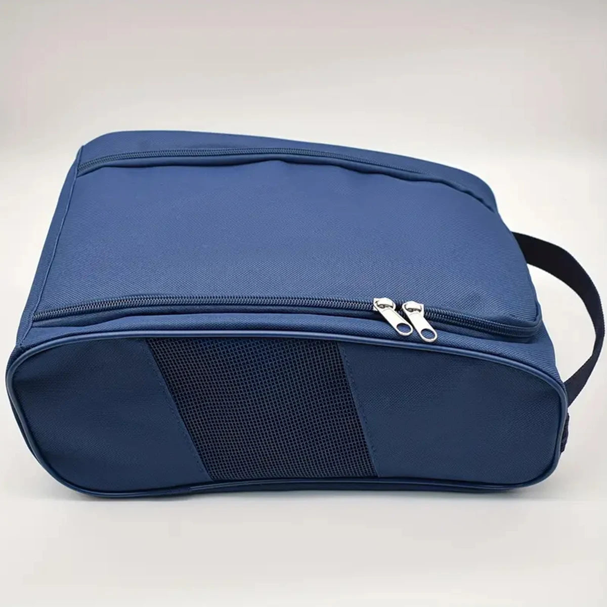 A navy blue breathable oxford cloth shoe storage bag shown from the top view.