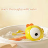 A yellow cartoon animal baby rattle floating in water, with text instructing to wash thoroughly.