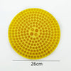 Yellow circular insert for a car wash bucket, featuring a grid of small holes and larger openings.