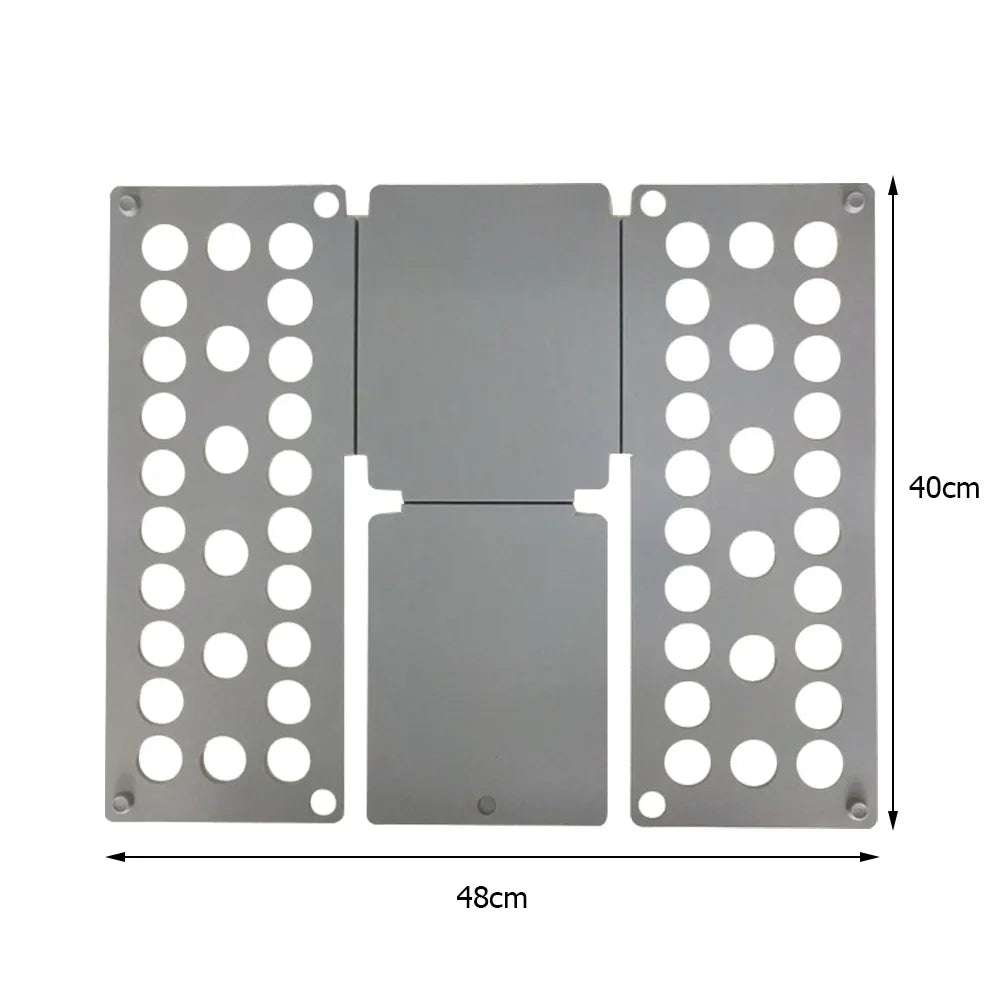 A gray plastic clothes folding board with multiple circular holes for hanging shirts and t-shirts.