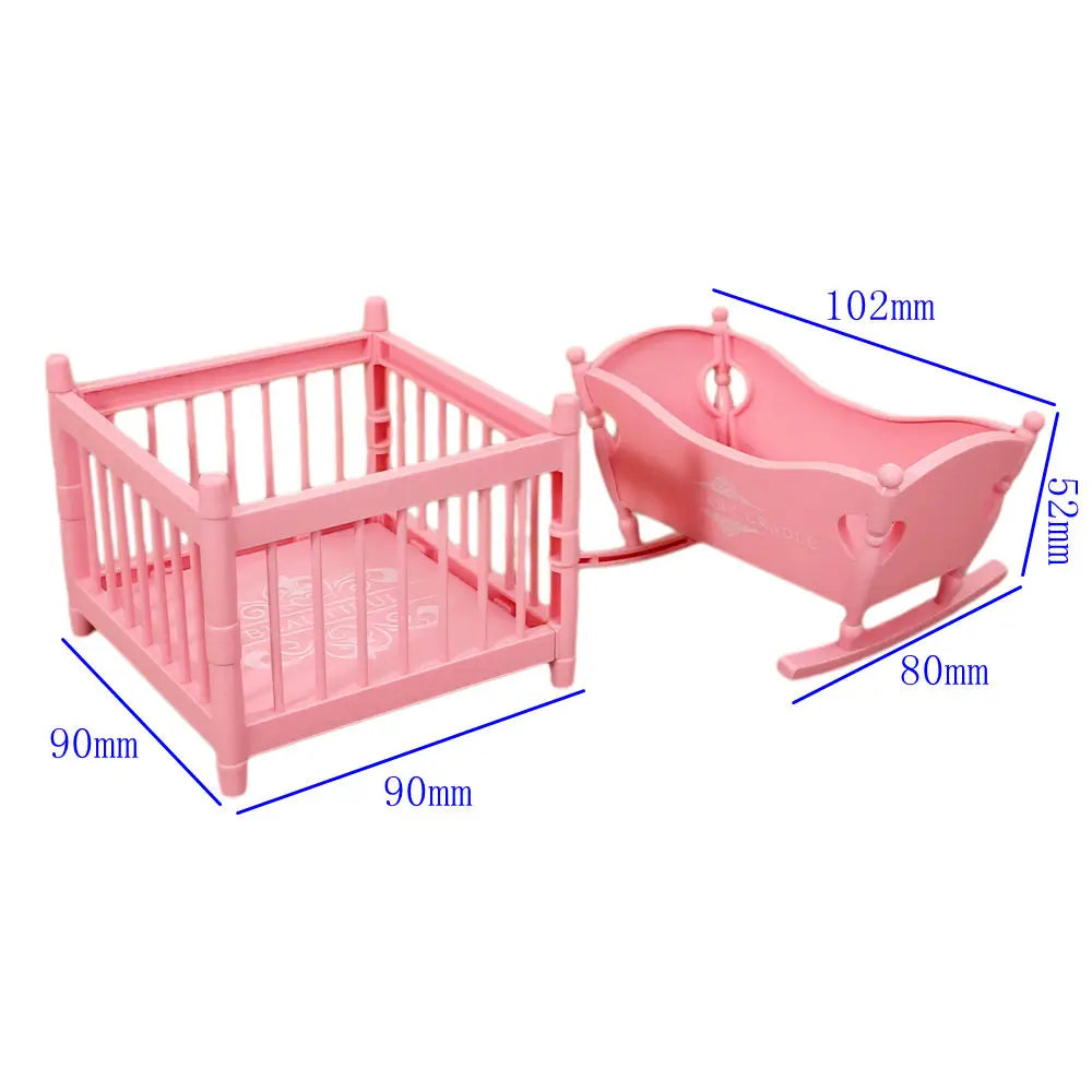 Pink fashion doll accessories set featuring a wooden crib and a doll carriage with various measurements shown.