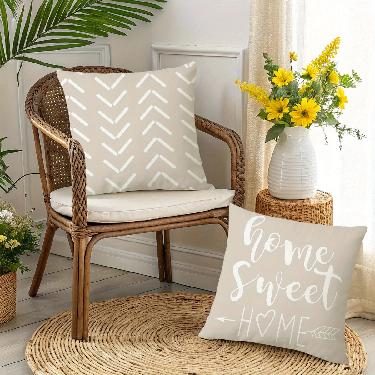 A cream decorative pillowcase with a geometric pattern rests on a wicker chair next to a yellow floral arrangement.