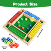 A wooden dice game set showing various colored dice arranged in a box with numbered slots.