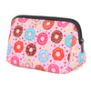 Pink cosmetic bag with a pattern of colorful donuts and hearts, featuring a black zipper.