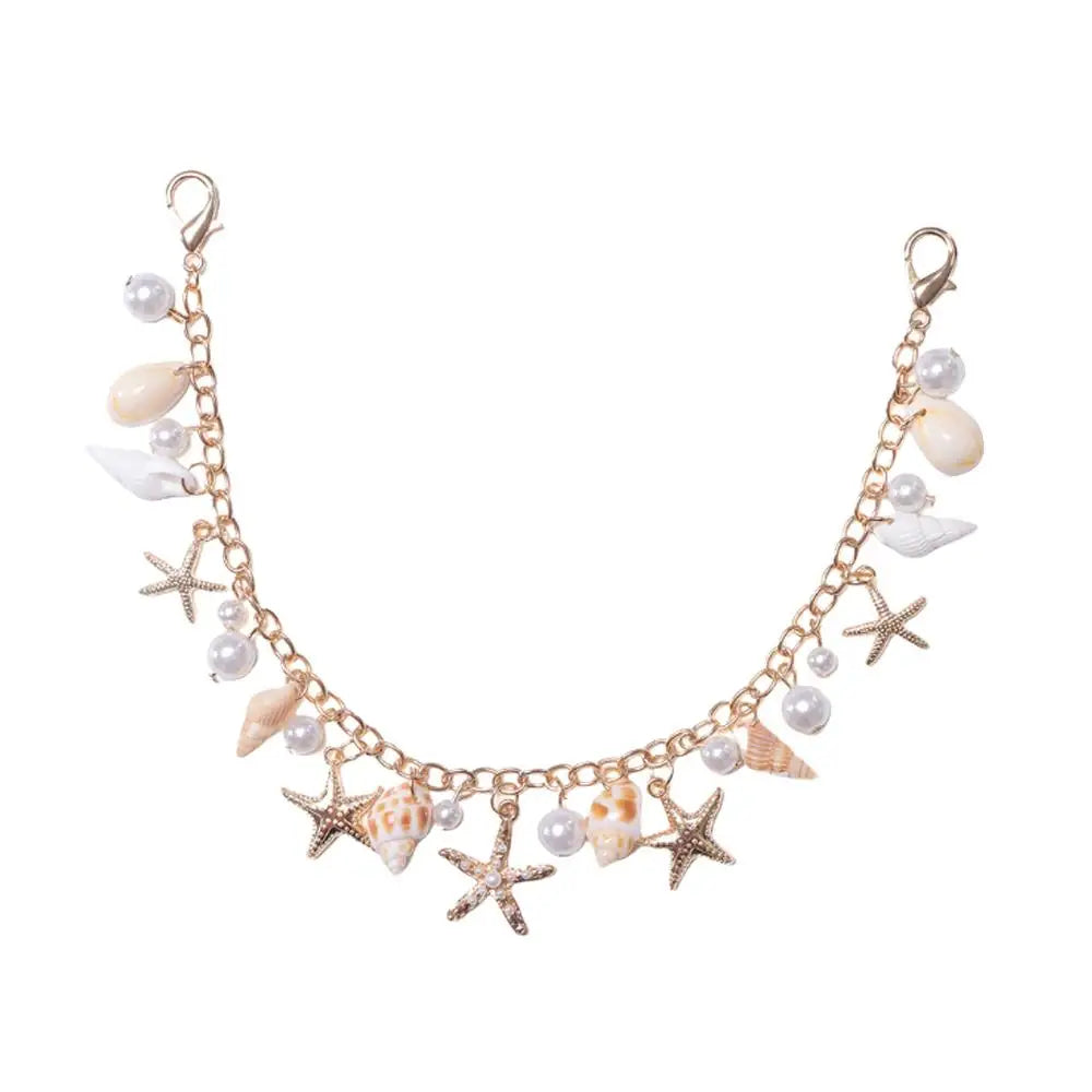 A delicate gold chain accessory featuring starfish and pearl beads.