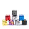 A stack of colorful metal fidget spinner cubes in red, silver, and blue.