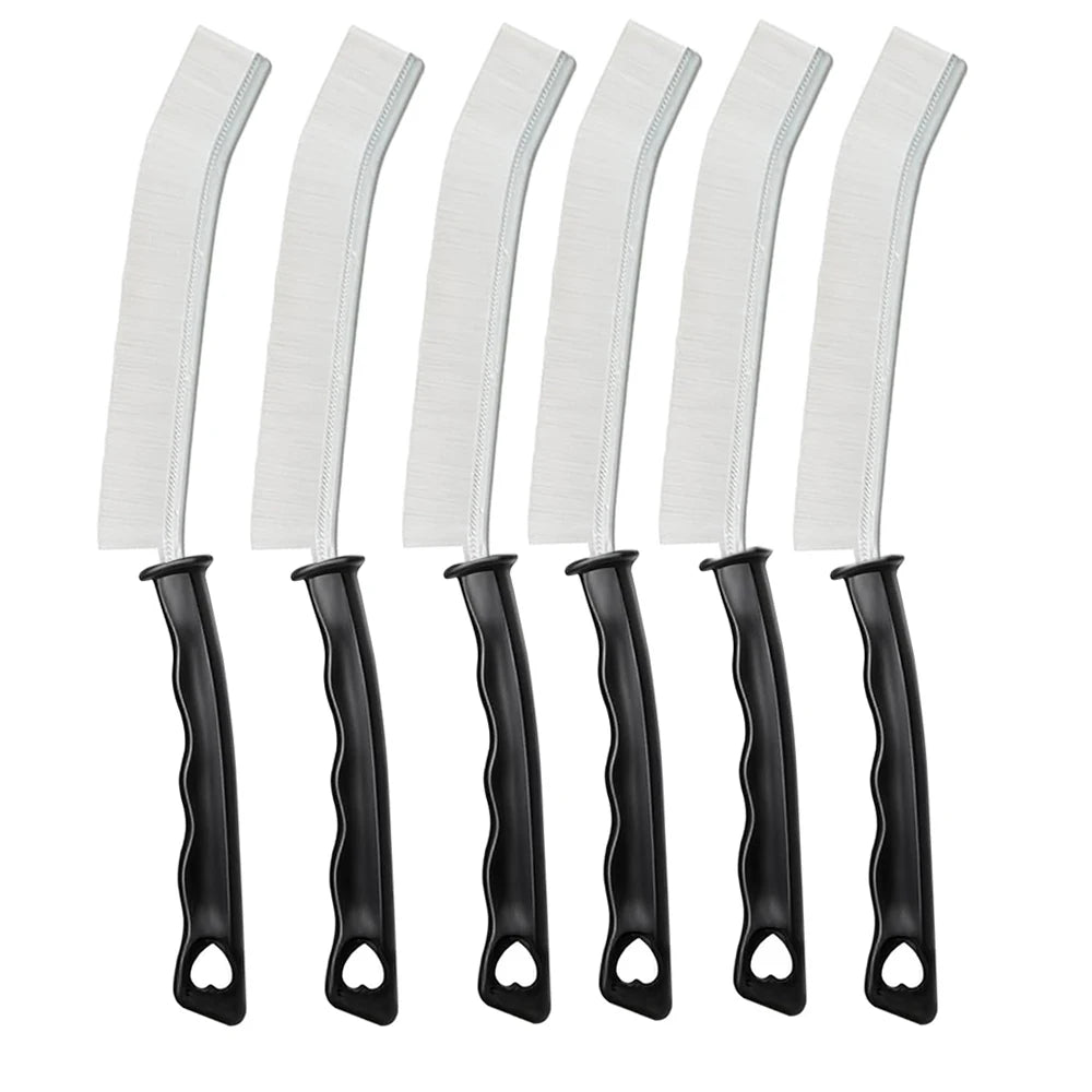 A set of white crevice cleaning brushes with black handles for tight spaces