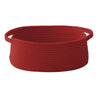 A deep red handwoven rope storage basket with handles.