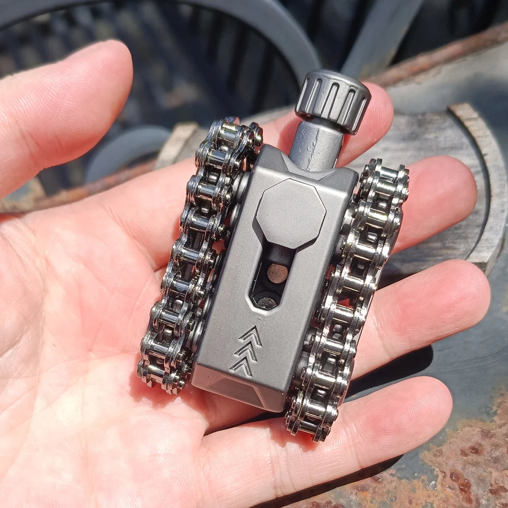 A hand holds a metal tactical tank fidget spinner with a rotating turret, showing the detailed gear mechanism.